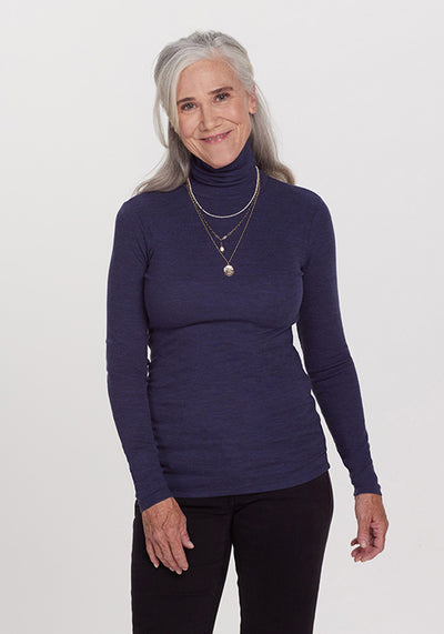 Model wearing Sage turtleneck - Navy Melange | Anne is 5’8”, wearing a size S