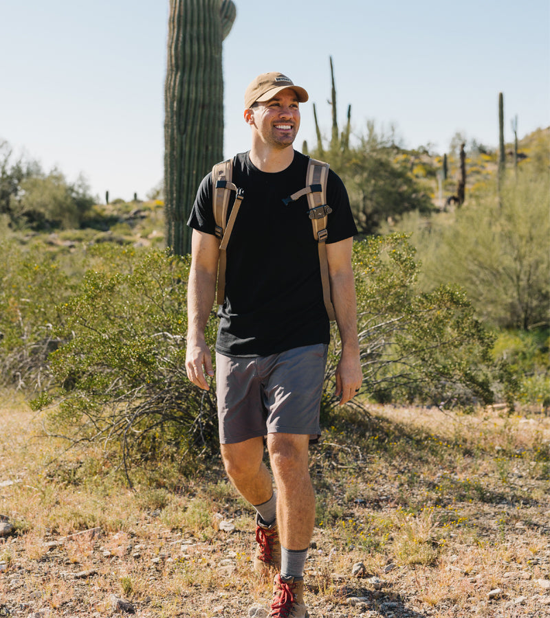 Male model wearing black Endurance tee and hiking