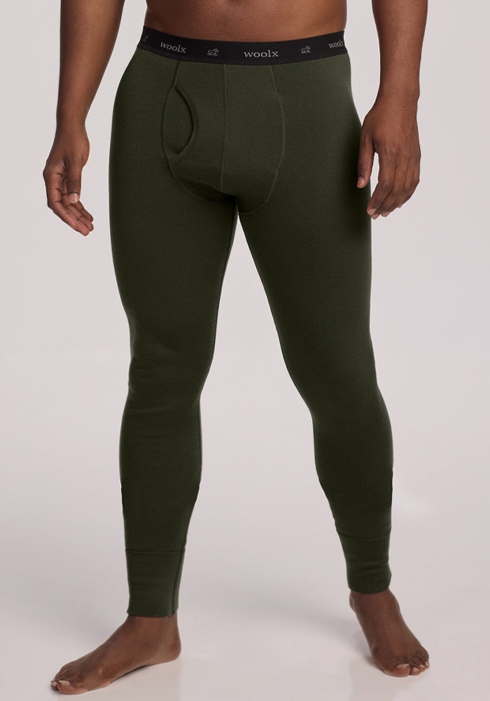 Person modeling Woolx Arctic Leggings in Duffel Bag, standing barefoot against a plain light background. 