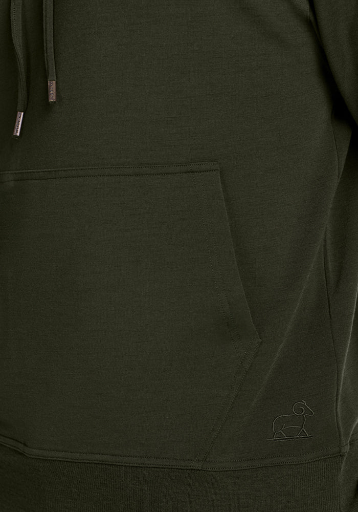 Close-up of the Woolx Chase Hoodie - Duffel Bag pocket with a small embroidered elephant logo near the bottom.
