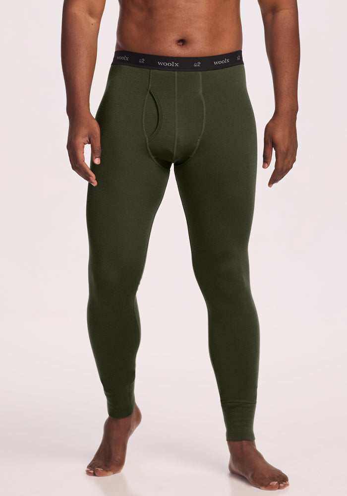 Someone wears Woolx Backcountry Leggings - Duffel Bag, a merino wool base layer, on a plain light background. 