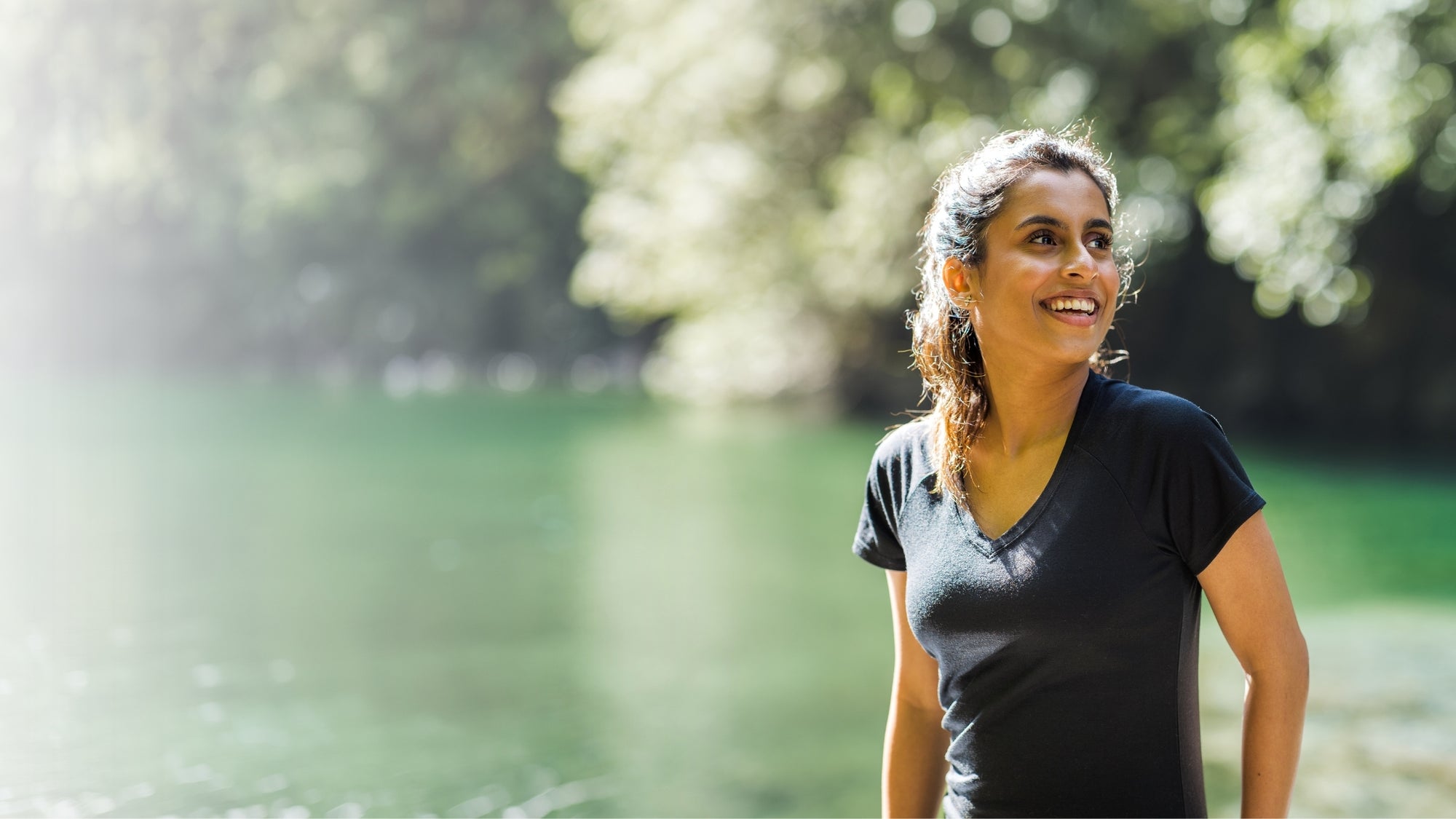 Woman wearing black mia tee standing outdoors