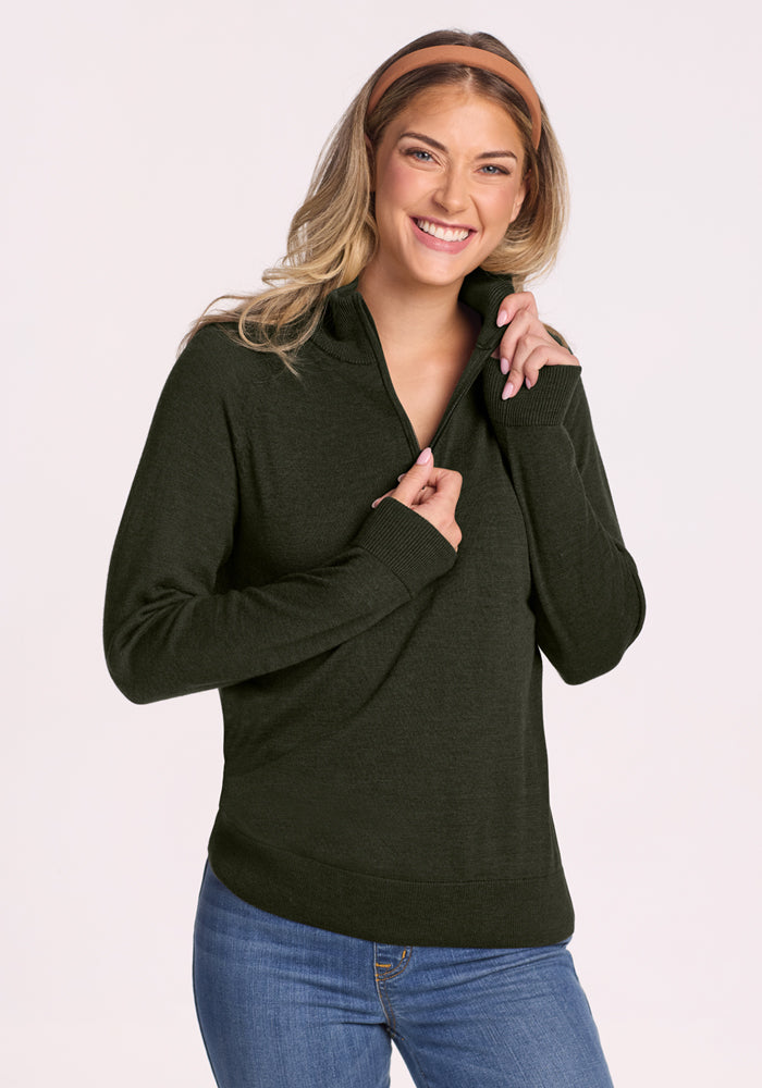 Woman in a Woolx Collins Half Zip Sweater - Duffel Bag, styled with blue jeans and a brown headband.