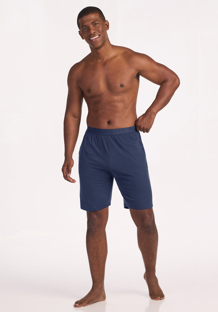 A man wearing navy blue Archer Lounge Shorts - Deep Dive merino wool lounge shorts.