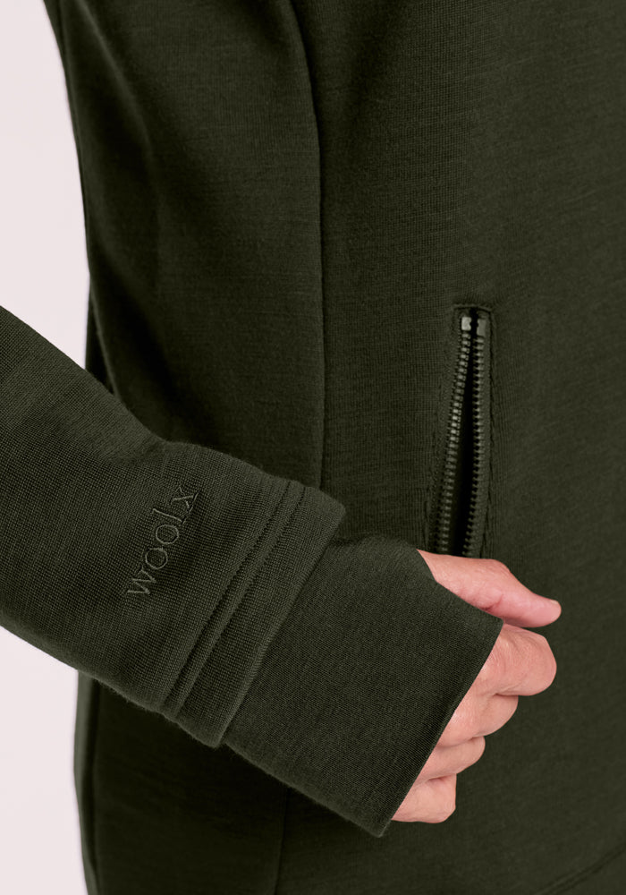Close-up of Woolx Cubby Hooded Sweatshirt - Duffel Bag sleeve with thumb hole and zip pocket, cozy and comfy.