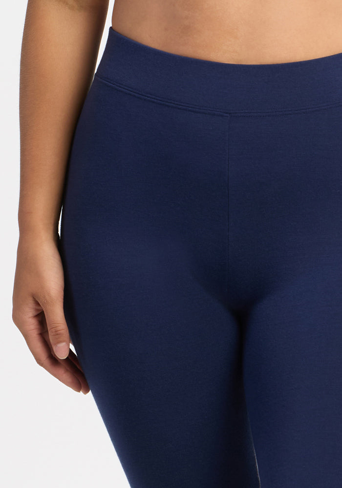 Person wearing Woolx Stella Tall - Ocean Cavern leggings, shown waist to mid-thigh against a plain backdrop.