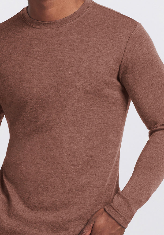 Model wearing Woolx Easton Crew Neck Shirt in Sable Heather, one hand in pocket, shown shoulders to hips.