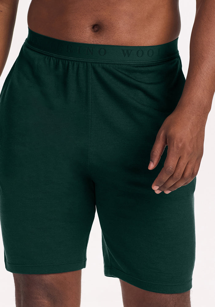 Woolx Archer Lounge Shorts - Deep Pine in dark green Merino wool with an elastic waistband on a person.