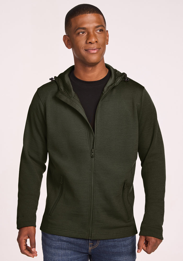 A man wearing a dark green Grizzly Sweatshirt - Duffel Bag zip-up hoodie over a black shirt. 