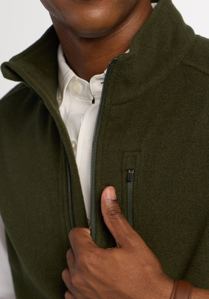 Close-up of a person wearing a heavyweight Everest Vest - Duffel Bag over a white collared shirt.