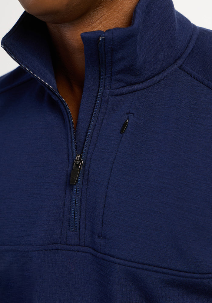Close-up of the Woolx Mason 1/4 Zip in Ocean Cavern, featuring chest pocket and exposed quarter-zip detail.