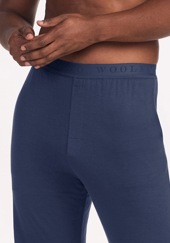Close-up of navy blue Woolx Arlo Lounge Pants - Deep Dive with a branded elastic waistband.