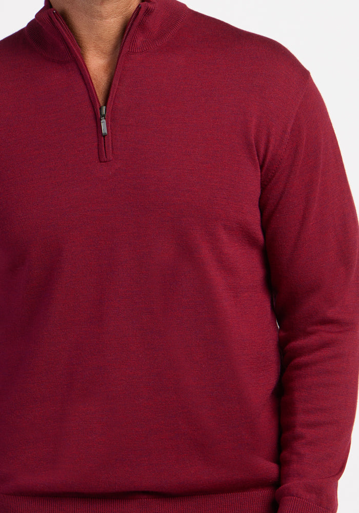 Individual in a Woolx Enzo Quarter Zip - Beet Red sweater, shown shoulders to waist against a white background.