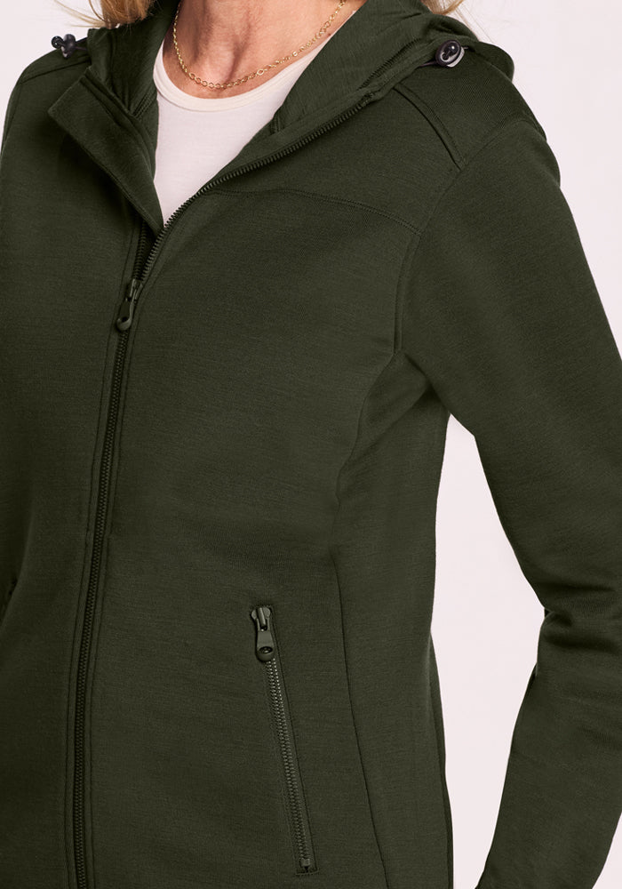 Woolx Cubby Hooded Sweatshirt in Duffel Bag, shown neck to hip with hand in pocket, on a light background.