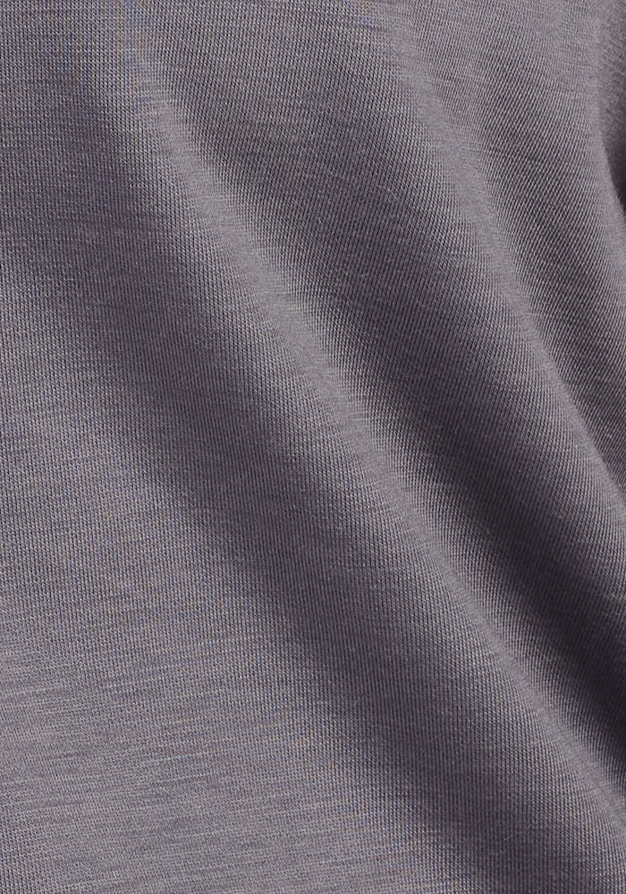 Close-up of the Woolx Mason 1/4 Zip in Arctic Dusk, showing smooth, gray Merino wool fleece with subtle diagonal folds and a fine, slightly ribbed texture that highlights its odor-resistant softness.