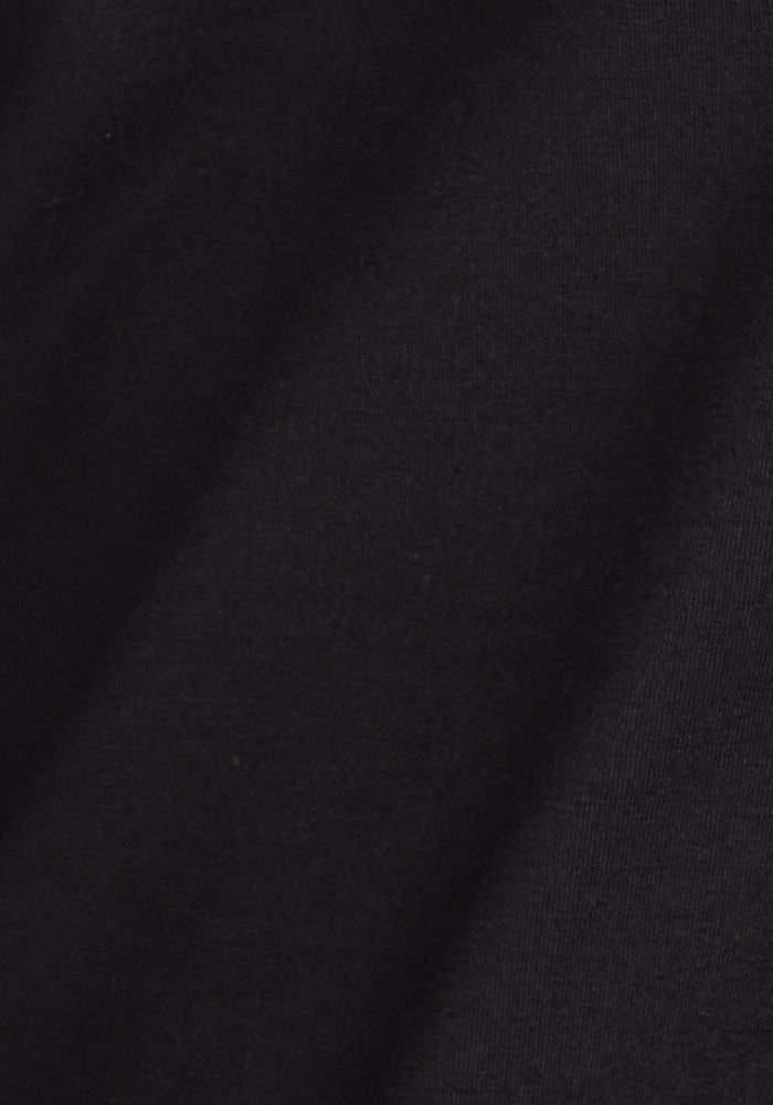 A close-up of the Woolx Mason 1/4 Zip - Black highlights its odor-resistant Merino wool fleece fabric with a soft texture and subtle diagonal folds.