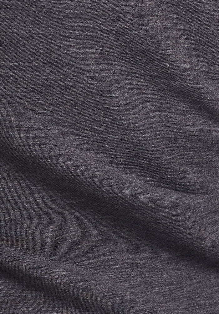 Close-up of the Woolx Edna Hooded Cardigan in Cinder Melange—a dark gray, heathered fabric with subtle texture and folds, ideal for a cozy cold weather sweater.
