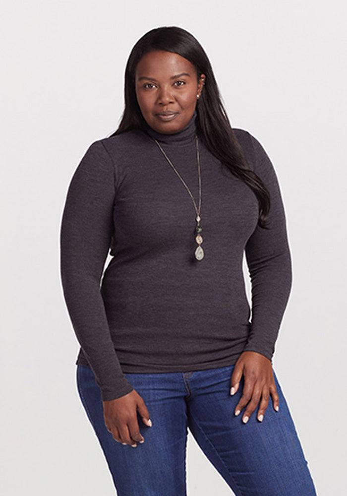Model wearing Sage turtleneck - Pebble Grey Melange | Le’Quita is 5’11”, wearing a size XL