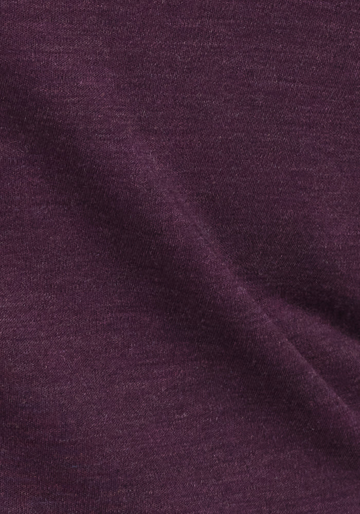 Close-up of the Woolx Rissa A Line Dress in Deep Plum, showcasing its soft fabric and smooth texture with subtle folds—perfect for fall and winter layering, highlighting the rich color and material details.