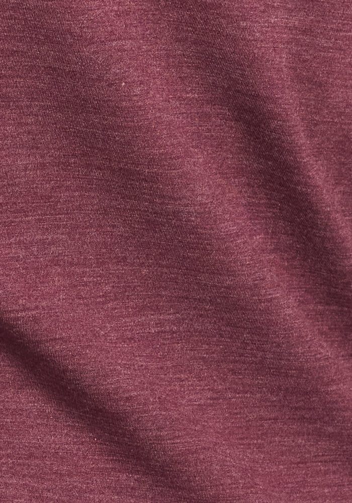 Close-up of the Woolx Frost Duralite® Leggings in Grape Harvest Melange, highlighting the soft, heathered fabric and subtle diagonal folds that showcase its premium thermal weave.