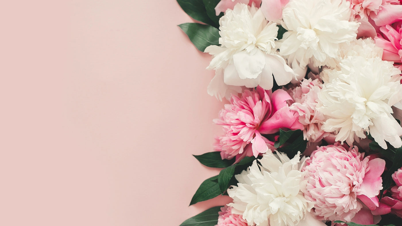 Pink background with flower bouquet on the side