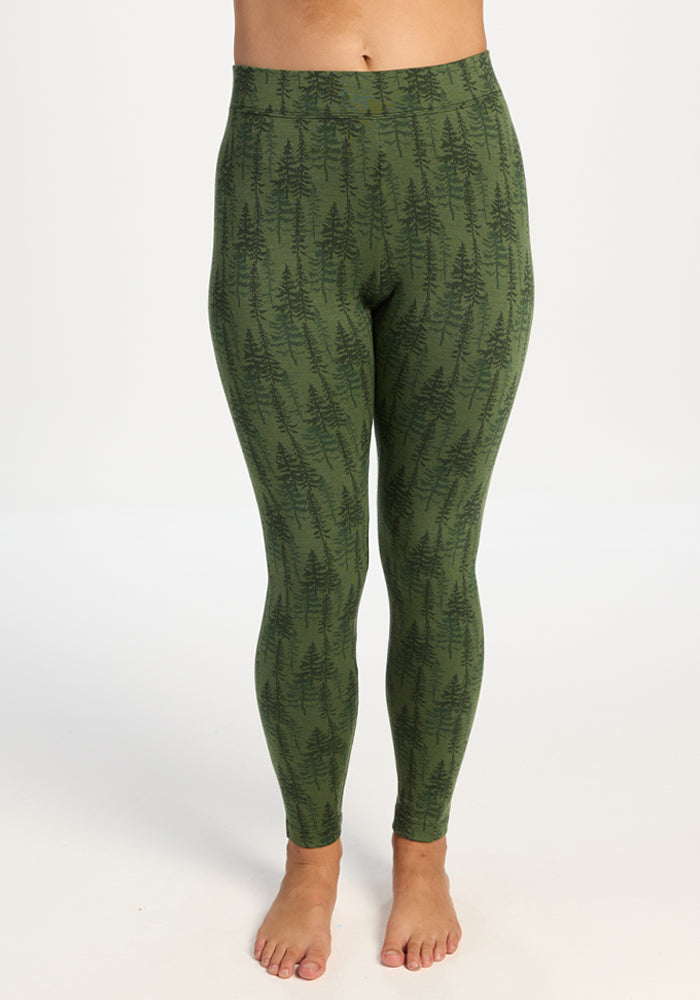 Model wears Woolx Taylor Baselayer Leggings - Forest Friends, barefoot, against a plain white background. 