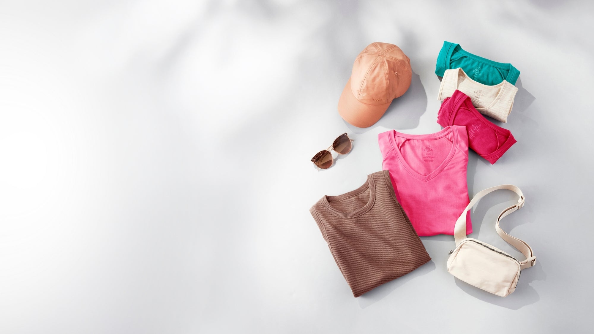 Various Woolx items spread on a white background. 