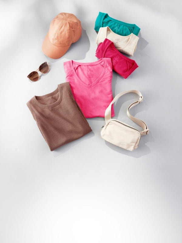 Collection of clothing and accessories on a light gray background