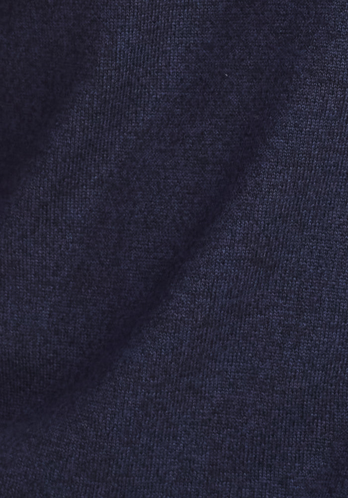 Close-up of Woolx Enzo Quarter Zip - Storm Cloud fabric, featuring soft, dark navy blue Merino wool with a slightly textured surface and gentle folds—ideal as a moisture-wicking, midweight layer.