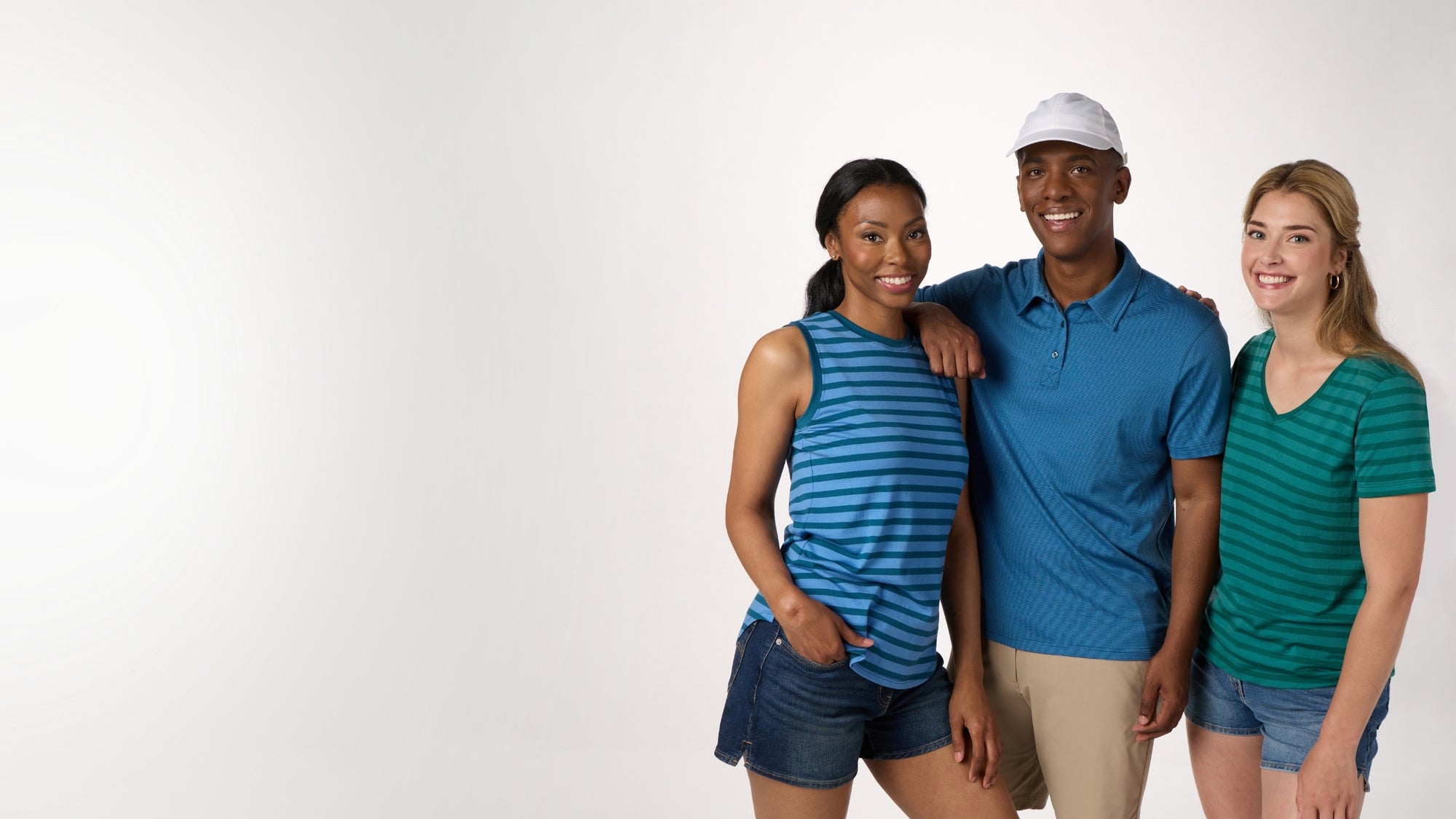 Three people standing together on a white background
