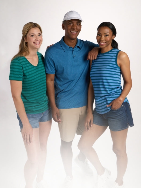 Three people wearing matching blue and green outfits on a white background