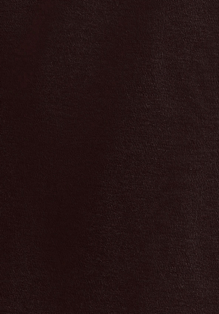 Close-up of Woolx Ryann Hoodie in French Roast, made from dark brown Merino wool with a breathable, fine texture. The tightly woven material offers a smooth, matte finish ideal for travel clothing. Lighting reveals subtle tone variations on the fabric's surface.