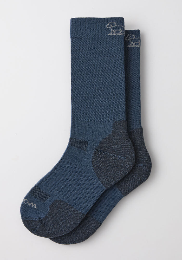 Woolx Mens Harbor Crew Sock in Majolica Blue with dark heels/toes and a small embroidered animal near the cuff.