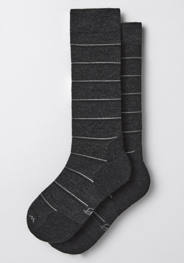 A pair of Woolx Mens Chandler Mid Calf Socks in dark grey charcoal, featuring a lightweight feel and thin light gray stripes, displayed neatly on a light gray background.