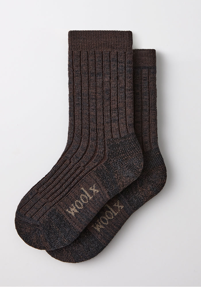 Two dark espresso Woolx Womens Joey Crew Socks, merino wool, “woolx” on soles, ribbed texture, laid flat on white.