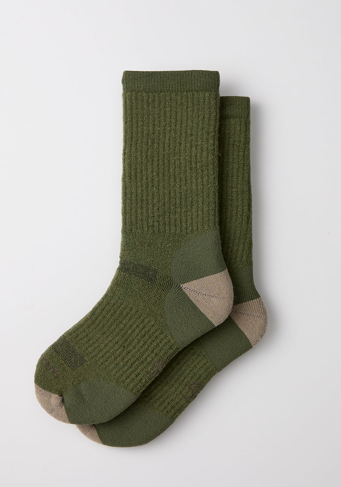 Woolx Mens Core Crew Socks in Winter Moss, with beige heels and toes, laid flat on a white background.