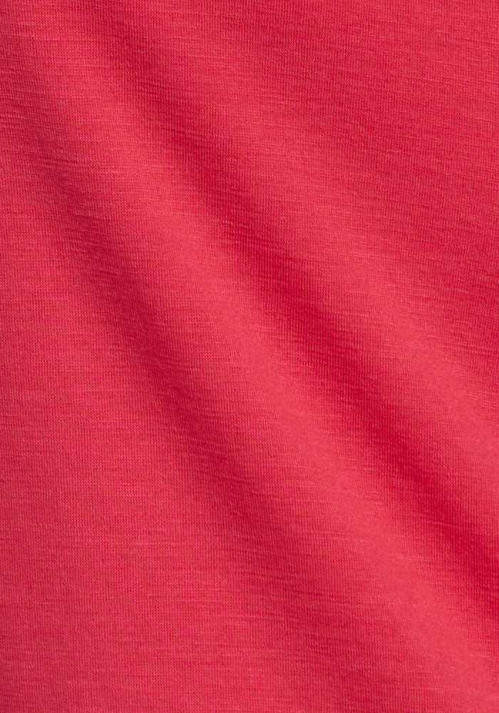 Close-up of smooth, red Berry Ice Pop Woolx Jenny 3/4 Sleeve Crew with fine texture and subtle shadow.