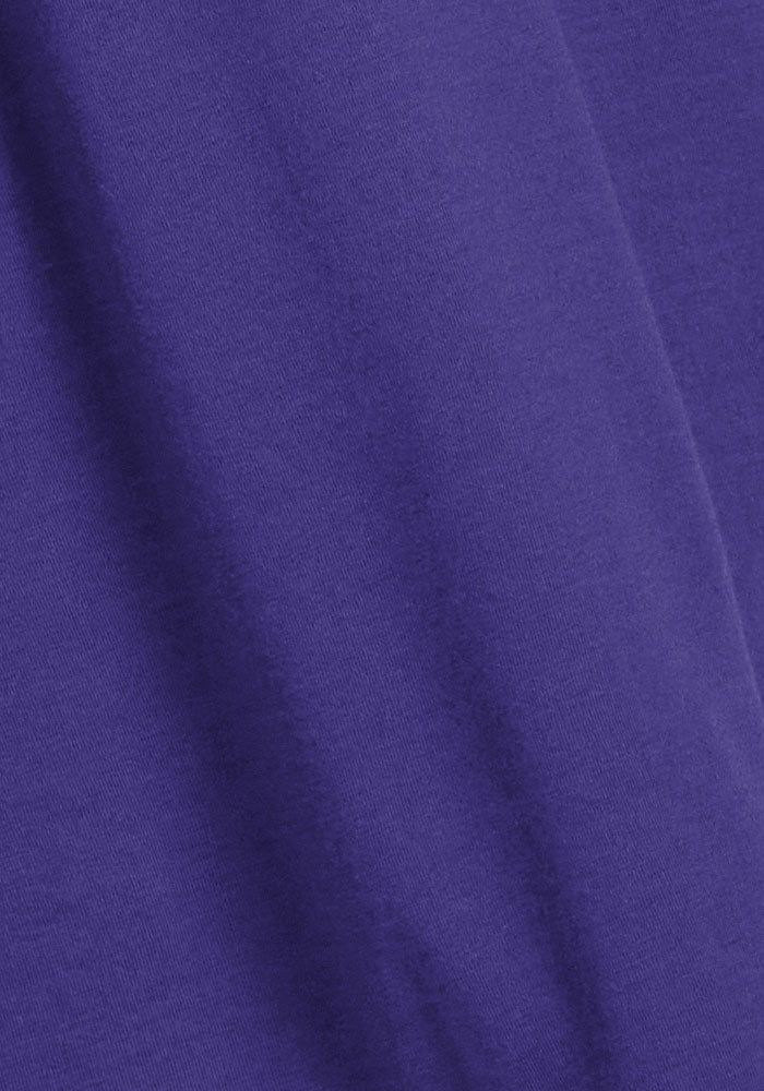 Close-up of the Woolx Cassie Dress - Berry Indigo, featuring smooth Merino wool with gentle folds and soft shadows.
