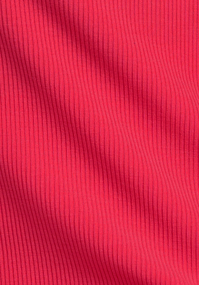 Close-up of Woolx Vivi Ribbed Tank - Berry Ice Pop fabric with vertical textured lines and gentle folds.
