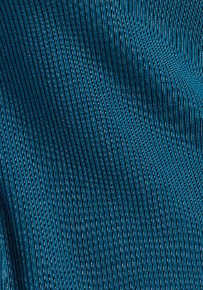 Close-up of Woolx Evie Petite Tunic in Blue Pine, showing teal ribbed Merino wool with soft waves and textured lines.
