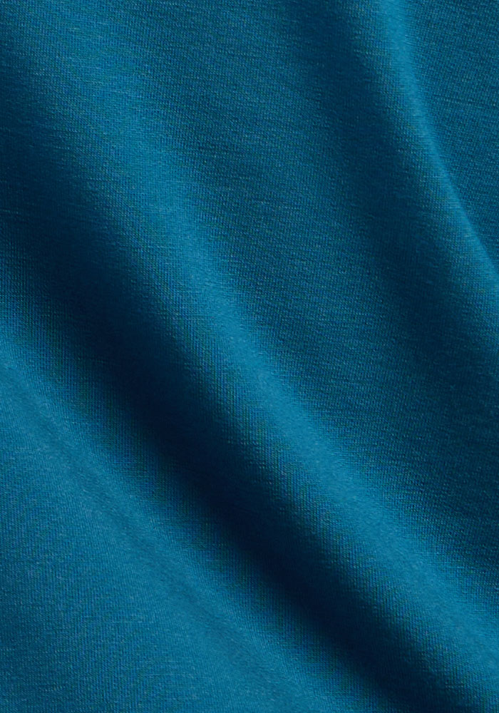 Close-up of blue pine fabric, ideal for Woolx Stella Leggings that offer a flattering fit and ultra-soft Merino wool texture.