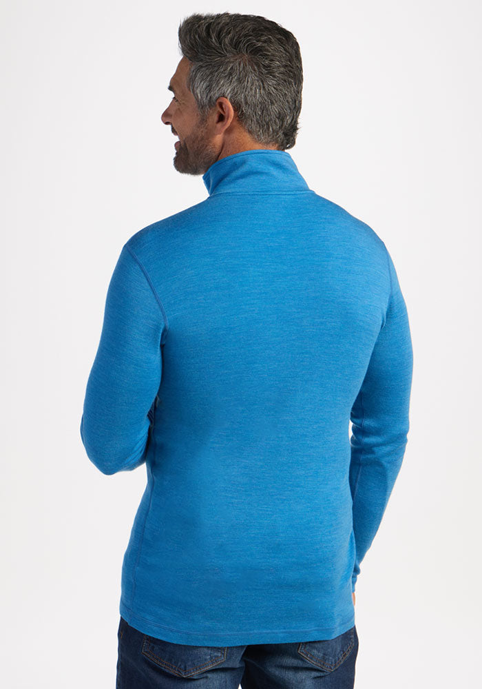 Man with short gray hair wears Woolx Explorer 1/4 Zip - Blue Razz, facing away against a white background.