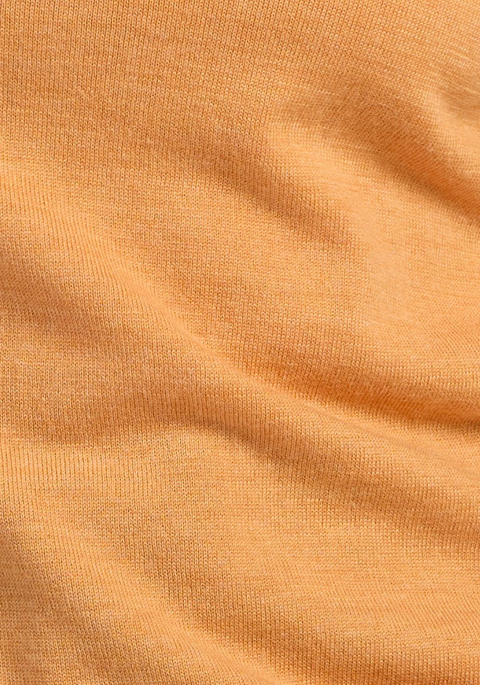 Close-up of Woolx Collins Half Zip Sweater in Butterscotch, highlighting knit texture and soft folds.