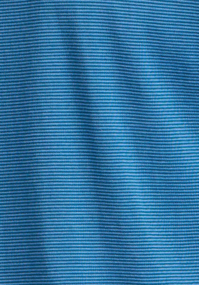 Close-up of the Woolx Preston Polo - Coastal Mini Stripe, featuring a blue moisture-wicking fabric with thin horizontal stripes and a subtle wavy texture.