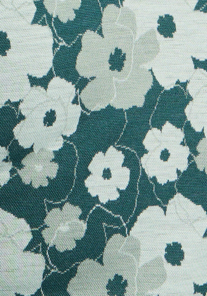 The Woolx Taylor Baselayer Leggings in Coastal Wildflower feature white and gray blooms—perfect Merino wool comfort.