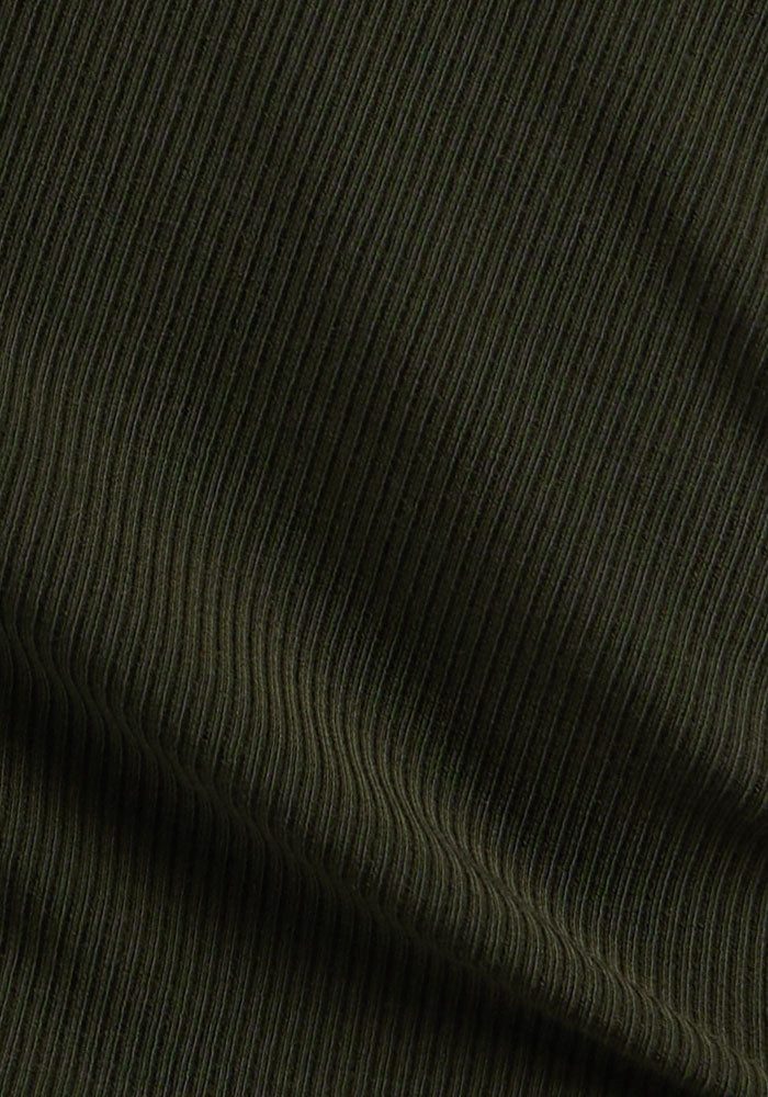 Close-up of Woolx Evie Ribbed Tunic - Duffel Bag: dark green, temperature-regulating fabric with fine vertical ribbing.