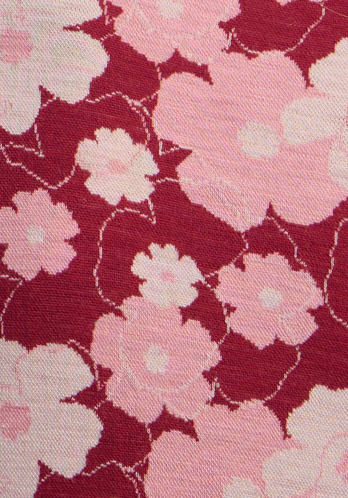 The Woolx Maddie Baselayer Top - Floral Crush features pink and white florals on textured red merino wool for cool days.