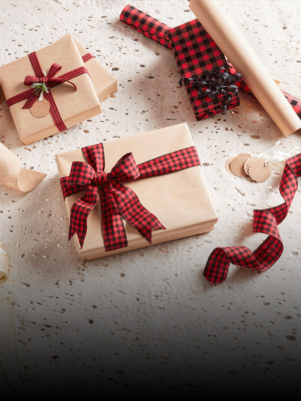 Wrapped gifts on plain background mobile image