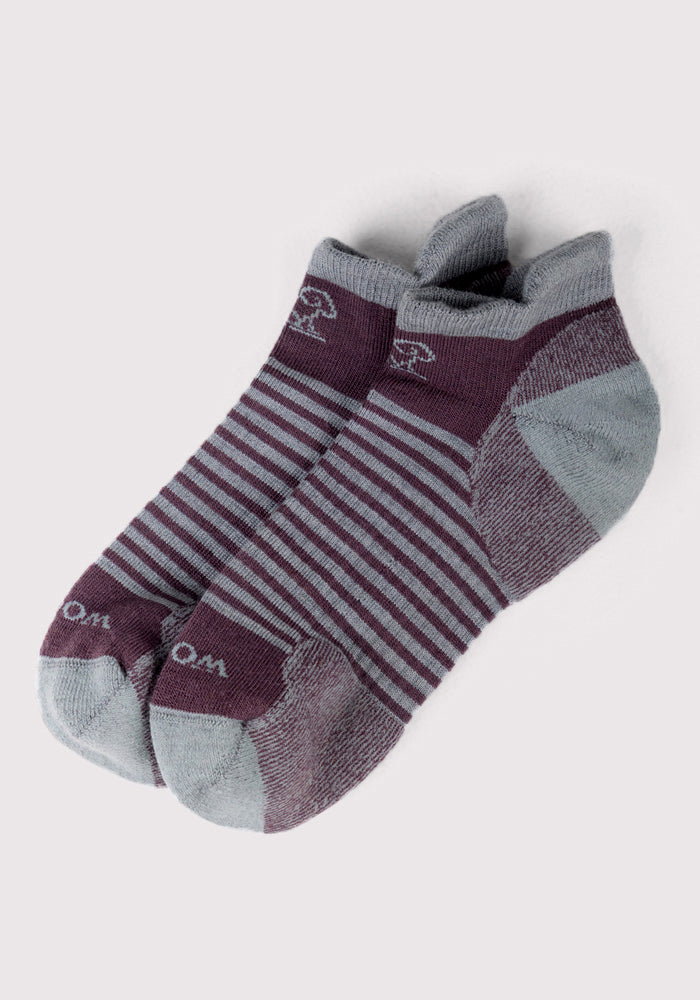 The Woolx Womens Amelia No Show Socks - Grape Harvest Stripe feature ankle-length, moisture-wicking comfort with maroon and gray stripes, solid gray accents, and a subtle mushroom design for stylish wear.