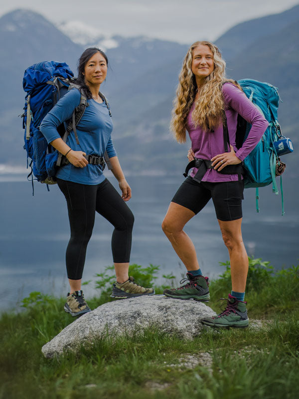 Two models wearing Woolx hiking on mountain mobile size